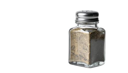 Glass pepper shaker isolated on solid white background 