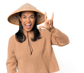 Young Filipina with Vietnamese hat showing a horns gesture as a revolution concept.