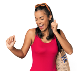 Young Filipina with beach bag dancing and having fun.