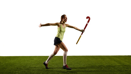Young triumphant field hockey player, running raising hands expressing happiness and joy on green...