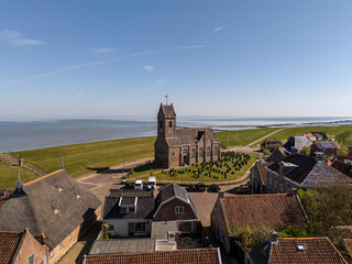 Idyllic Church by the Sea – Aerial View of Wierum, Netherlands