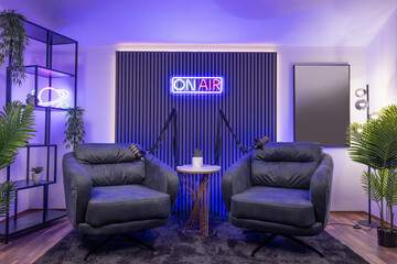 Modern podcast recording studio with professional lighting