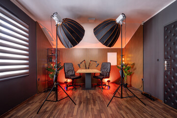 Modern podcast recording studio with professional lighting