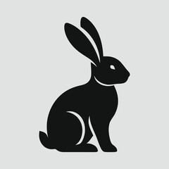 Obraz premium Rabbit sitting with long ears silhouette vector illustration