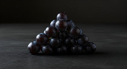Pile Of Fresh Grapes In Pyramid Shape On Dark Background
