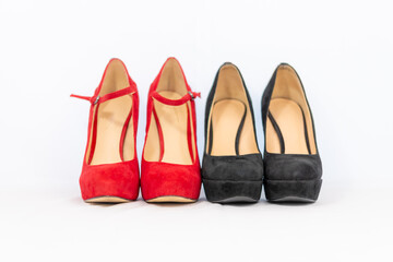 black and red pumps next to each other with a white background