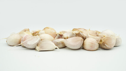 Fresh Peeled Garlic Bulb and Cloves isolated on white background