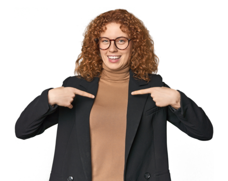 Young Caucasian redhead in business attire surprised pointing with finger, smiling broadly. - Powered by Adobe