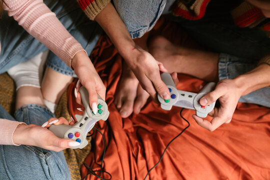 Group of Friends Playing Video Games Together Enthusiastically