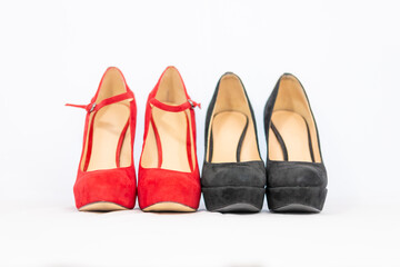 black and red pumps next to each other with a white background