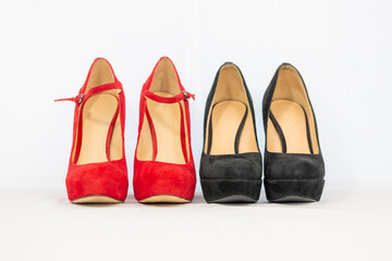 black and red pumps next to each other with a white background