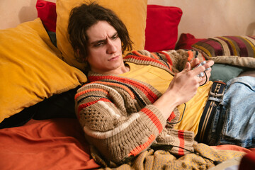 Young Man Playing While Lying Down On A Game Console