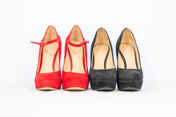 black and red pumps next to each other with a white background