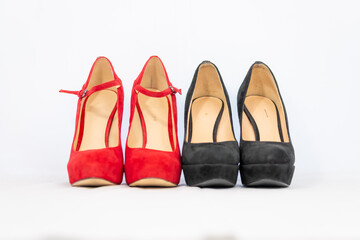 black and red pumps next to each other with a white background