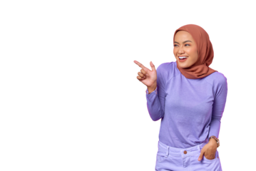 Portrait of smiling young Asian woman pointing finger at copy space isolated on transparent background