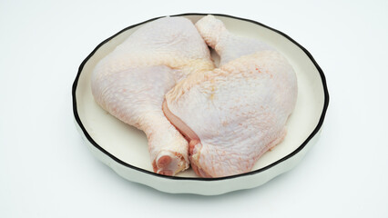 Chicken thighs  on a white background