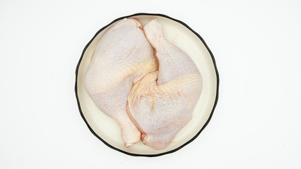 Chicken thighs  on a white background