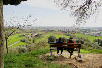 View from Ezzelino tower with bench and people sitting, Vicenza, Italy