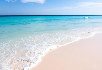 Fototapeta premium Calm turquoise water laps a pristine white sand beach at Playa Chelem, daytime, water