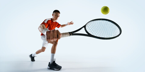 Low angle view of man, tennis player prepares for return shot with intense focus and readiness against white studio background. Concept of sport, game, tournament, practice, youth © master1305