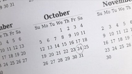 marking 24 October date on the calendar	
