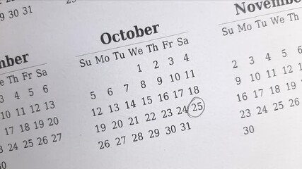 marking 25 October date on the calendar	
