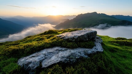 A rocky landscape illuminated by the soft glow of sunrise emerging from behind misty hills, creating a captivating and serene atmosphere for nature lovers and photographers.