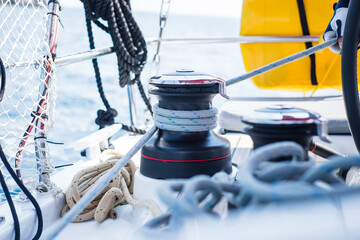 Sailing yacht ropes and winch. Sailboat equipment details. Water transport, marine travel lifestyle vacation theme.