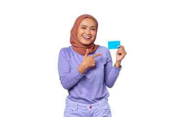 Smiling young Asian woman pointing finger at credit card isolated on transparent background
