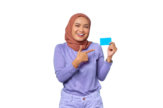 Smiling young Asian woman pointing finger at credit card isolated on transparent background