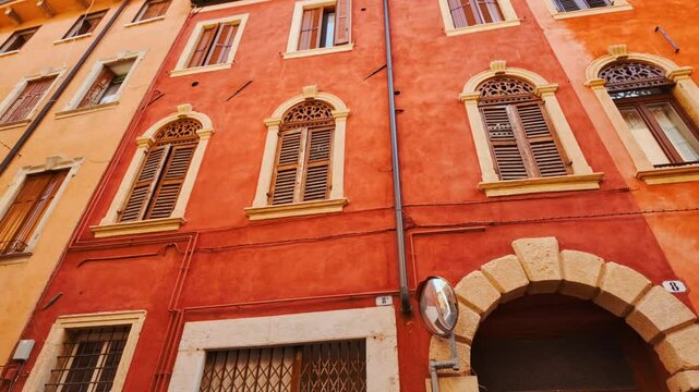 Charming old town buildings with colorful facades and tiled roofs in Old Town, Verona, Veneto, Italy