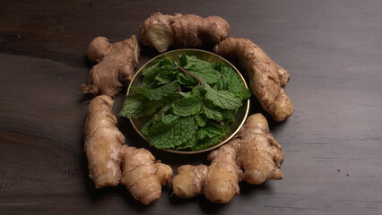 Ginger root vegetables and fresh mint leaves Concept health diet.
