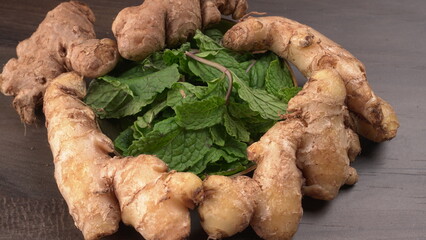 Ginger root vegetables and fresh mint leaves Concept health diet.
