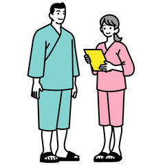  健康診断のリストを確認する検査着を着た男女