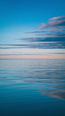Obraz premium Calm water, serene sky, peaceful scene.