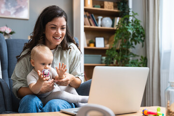 Young intelligent innovative single mother presenting her startup new business idea via video call...