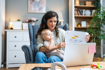 Young intelligent innovative single mother presenting her startup new business idea via video call...