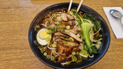 A delicious Ramen Bowl with tender Grilled Chicken and a variety of Fresh Vegetables