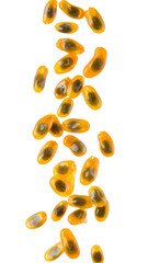 Multiple passion fruit seeds falling on a transparent background