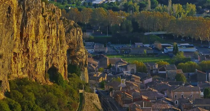 Mornas Fortress stands majestically on top of a rocky cliff. The Fortress of Mornas is a medieval fortress above the village of the same name in the French department of Vaucluse
