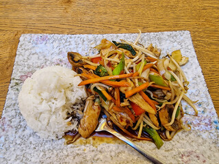 Delight in the Savory, Delicious, and Flavorful StirFried Vegetables Served Alongside Fluffy Rice...