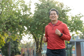 Obraz premium Senior old man runner exercise outdoor nature park. fitness man jogging wearing sportswear. Mature athlete man in sportswear Workout running at public park. Health and activity old man lifestyle