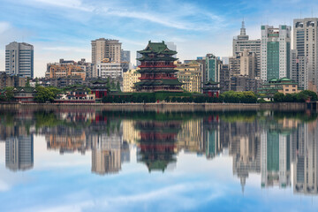 Majestic Modern City Meets Historical Elegance Reflected in Tranquil Waters