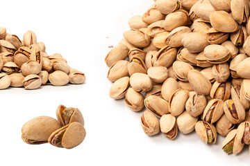 Tasty pistachios isolated on a white background.