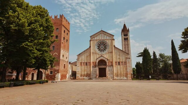 Romanesque facade of Basilica di San Zeno Maggiore in Verona, Veneto, Italy adorned with intricate stone carvings and twin towers