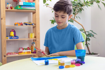 Young Artist Painting with Watercolors in Creative Home Environment. Art Therapy Session. sensory activities for children with autism. 