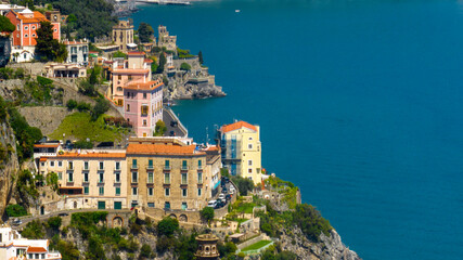 Naklejka premium Aerial view of beautiful houses and apartments overlooking the sea in the Amalfi Coast. It is a stretch of coast on the Gulf of Salerno, in Campania region, Italy.