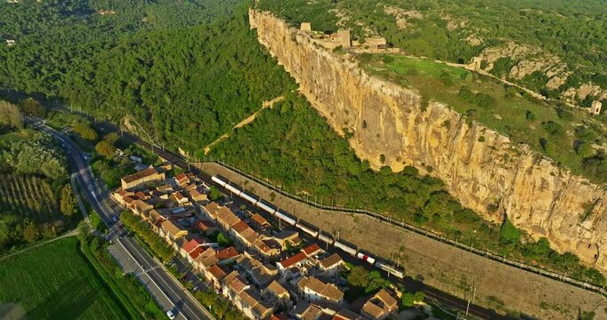 Mornas Fortress stands majestically on top of a rocky cliff. The Fortress of Mornas is a medieval fortress above the village of the same name in the French department of Vaucluse