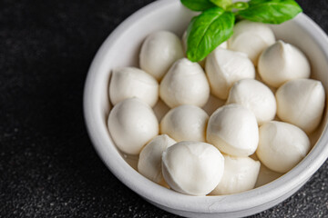 Mozzarella mini cheese balls dish fresh delicious gourmet food background on the table rustic food top view copy space
