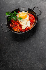 Fried egg tomatoes shakshuka vegetable dish appetizer fresh delicious gourmet food background on the table rustic food top view copy space vegetarian  food